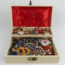 A jewellery box of costume jewellery including a coral bead necklace.