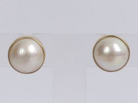 A Pair of 9ct gold Mabe pearl earrings, 13mm.