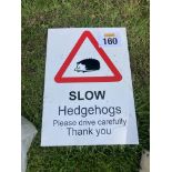 SLOW HEDGE HOGS SIGN
