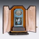 A FINE EARLY 20TH CENTURY SWISS SOLID SILVER AND GUILLOCHE ENAMEL TRAVEL CLOCK IN DISPLAY CASE