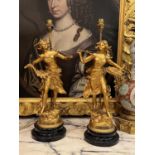 AFTER GEORGES MAXIM (1885-1940): A PAIR OF GILT METAL FIGURAL LAMP BASES