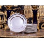 A SET OF 24 STERLING SILVER 19TH CENTURY DINNER PLATES BY ROBERT GARRARD II, 1865