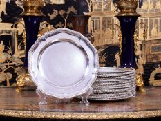 A SET OF 24 STERLING SILVER 19TH CENTURY DINNER PLATES BY ROBERT GARRARD II, 1865