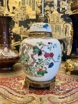 A LATE 19TH CENTURY CHINESE FAMILLE VERTE PORCELAIN URN CONVERTED TO A LAMP BASE