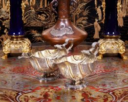 A PAIR OF GEORGE III STERLING SILVER AND SILVER GILT SAUCE BOATS AND LADLES