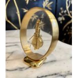 A JAEGER LE COULTRE POLISHED BRASS AND GLASS SKELETON MYSTERY CLOCK