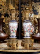 A FINE PAIR OF 18TH CENTURY CHINESE PORCELAIN AND GILT BRONZE MOUNTED VASES