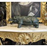 A LARGE PATINATED BRONZE MODEL OF A HIPPO