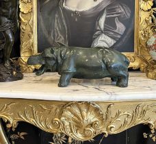 A LARGE PATINATED BRONZE MODEL OF A HIPPO