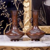 A FINE PAIR OF LATE 19TH CENTURY JAPANESE BRONZE VASES INLAID WITH PRECIOUS METALS