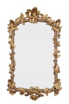 A REGENCY STYLE WALL MIRROR DECORATED WITH OAK LEAVES