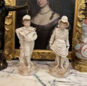 A LARGE PAIR OF 19TH CENTURY BISQUE PORCELAIN FIGURES OF A GIRL AND BOY