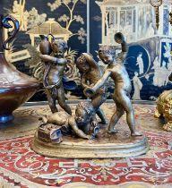 AFTER CLAUDE MICHEL CLODION (1738-1814): A 19TH CENTURY BRONZE GROUP OF PUTTI