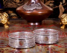 A FINE PAIR OF GEORGE III STERLING SILVER WINE COASTERS C. 1770