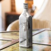 A LARGE SOLID SILVER JOHNNIE WALKER NOVELTY WHISKY BOTTLE