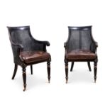 A PAIR OF REGENCY STYLE CANED LIBRARY ARMCHAIRS