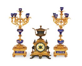 A LATE 19TH CENTURY BRONZE CLOCK GARNITURE IN THE STYLE OF BARBEDIENNE