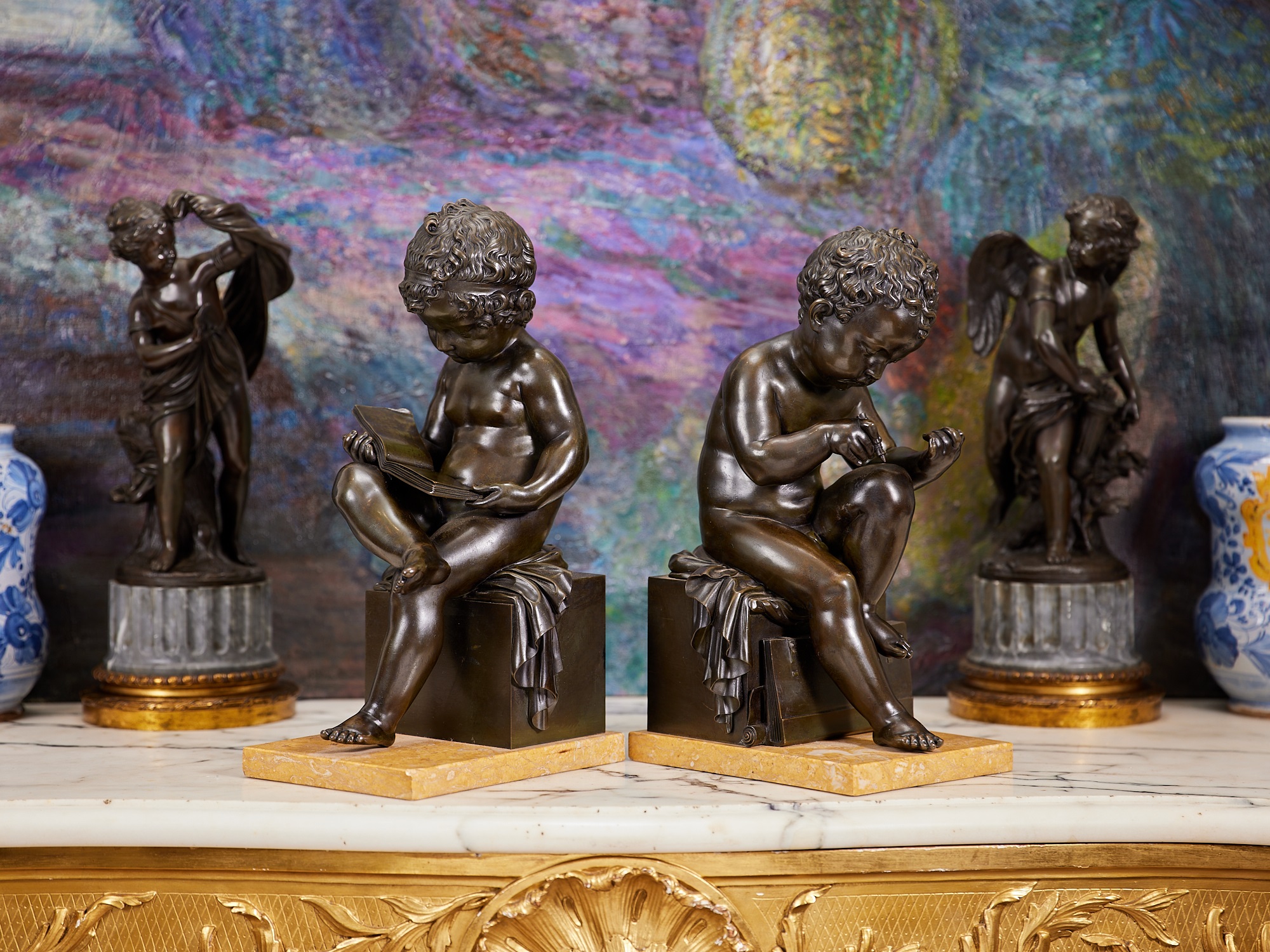 A PAIR OF EARLY 19TH CENTURY BRONZE MODELS OF CHILDREN AFTER THE MODEL BY CHARLES-GABRIEL SAUVAGE