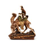 AN EARLY 20TH CENTURY ORIENTALIST PORCELAIN MODEL OF A LION HUNTER