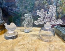 LALIQUE: A GLASS PERFUME BOTTLE AND TWO PAPERWEIGHTS