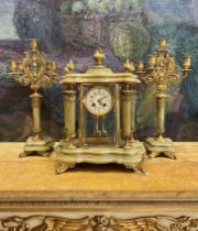 A LATE 19TH / EARLY 20TH CENTURY ONYX AND ORMOLU CLOCK GARNITURE