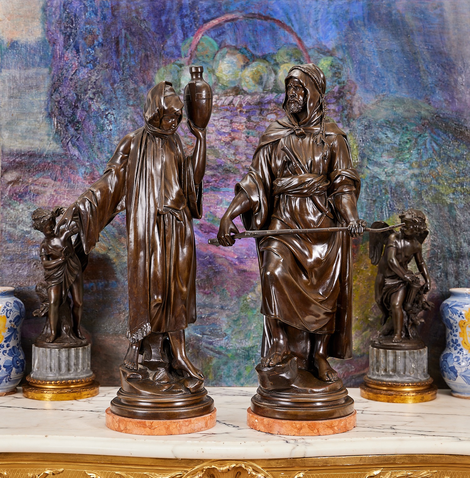 A LARGE PAIR OF LATE 19TH CENTURY FIGURES OF AN ARAB AND MAIDEN