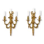 A PAIR OF EARLY 20TH CENTURY FRENCH GILT BRONZE LOUIS XVI STYLE WALL LIGHTS