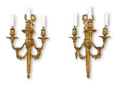 A PAIR OF EARLY 20TH CENTURY FRENCH GILT BRONZE LOUIS XVI STYLE WALL LIGHTS