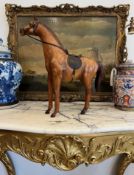 A LIBERTY STYLE LEATHER MODEL OF A HORSE