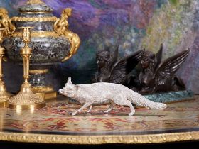 A STERLING SILVER MODEL OF A FOX