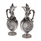 A MASSIVE PAIR OF 19TH CENTURY GERMAN SILVER AND GLASS CLARET JUGS, C.1890