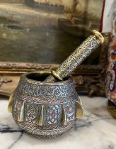 A 19TH CENTURY CAIROWARE SILVER INLAID BRONZE PESTLE AND MORTAR WITH QURANIC SCRIPT