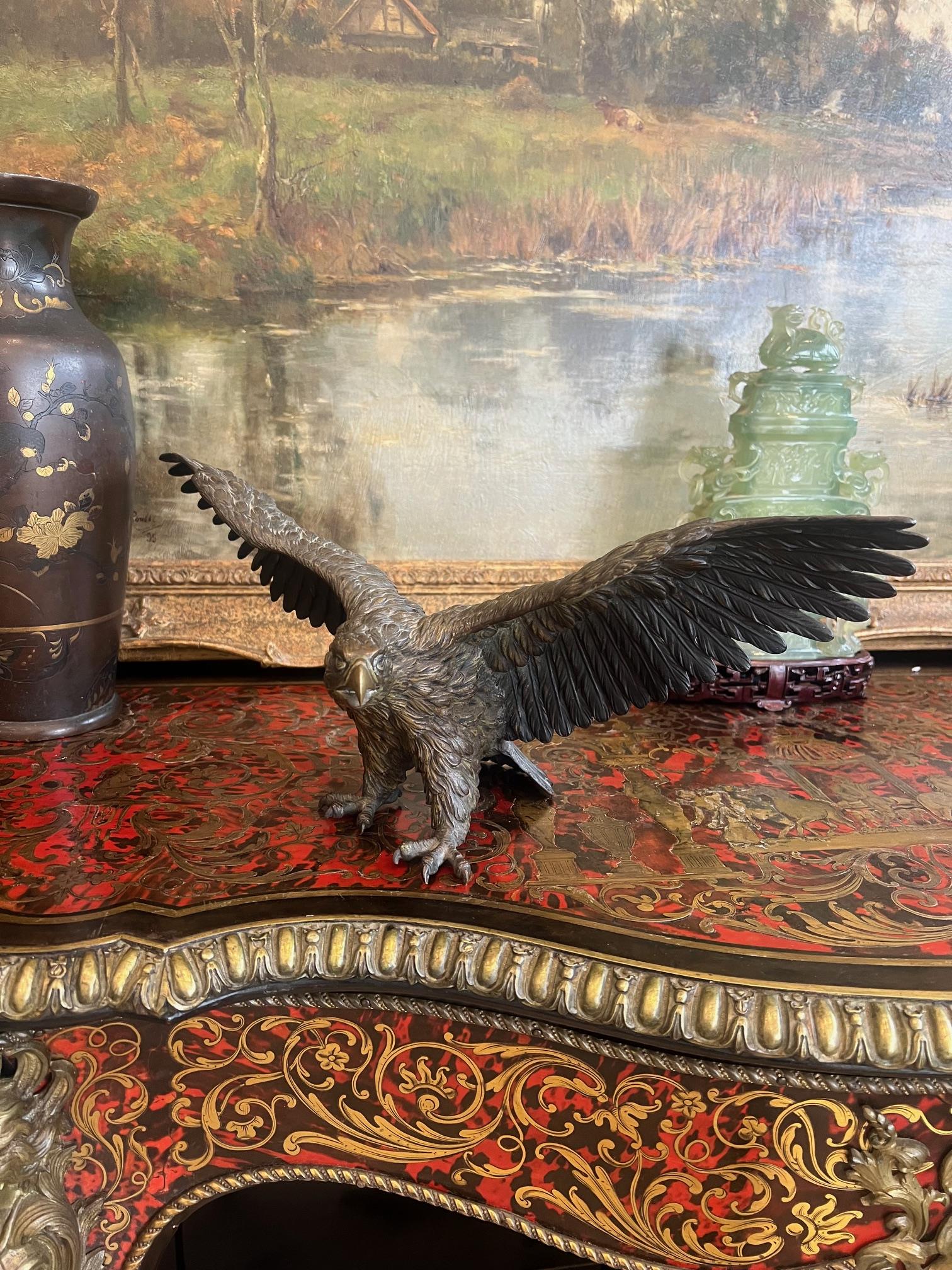 A LATE 19TH CENTURY BRONZE MODEL OF AN EAGLE