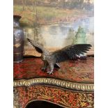 A LATE 19TH CENTURY BRONZE MODEL OF AN EAGLE