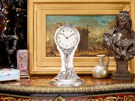 AN ART NOUVEAU PERIOD STERLING SILVER CLOCK, C. 1913