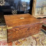 A LATE 19TH CENTURY ARMY & NAVY OAK TRAVELLING BOX