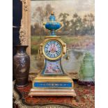 A FINE 19TH CENTURY PORCELAIN MANTEL CLOCK REPUTEDLY OWNED BY EMPRESS EUGENIE, WIFE OF NAPOLEON III