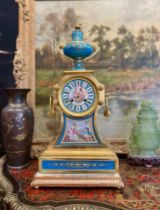 A FINE 19TH CENTURY PORCELAIN MANTEL CLOCK REPUTEDLY OWNED BY EMPRESS EUGENIE, WIFE OF NAPOLEON III