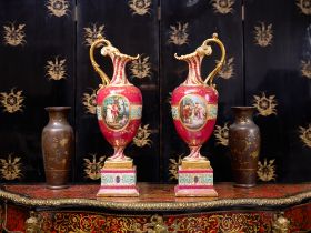 A LARGE PAIR OF 19TH CENTURY VIENNA PORCELAIN EWERS