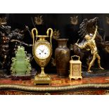 AN EARLY 19TH CENTURY EMPIRE PERIOD PATINATED AND GILT BRONZE MANTEL CLOCK
