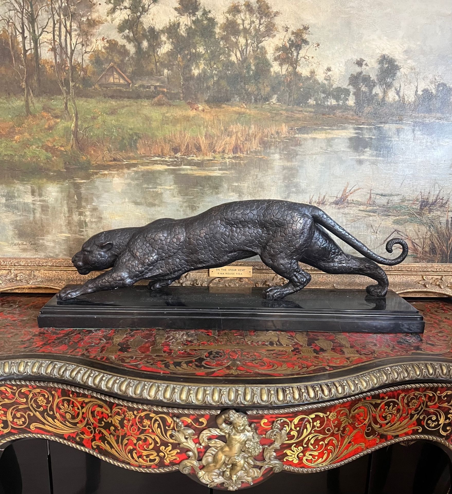A LARGE BRONZE MODEL OF A STALKING PANTHER