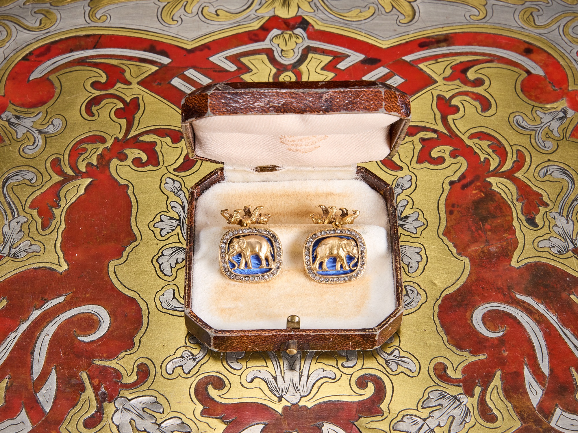 A PAIR OF FABERGE STYLE DIAMOND ENCRUSTED, SILVER GILT AND ENAMELLED CUFFLINKS