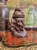 A LATE 19TH CENTURY BLACK FOREST CARVED WOOD TOBACCO JAR IN THE FORM OF VOLTAIRE