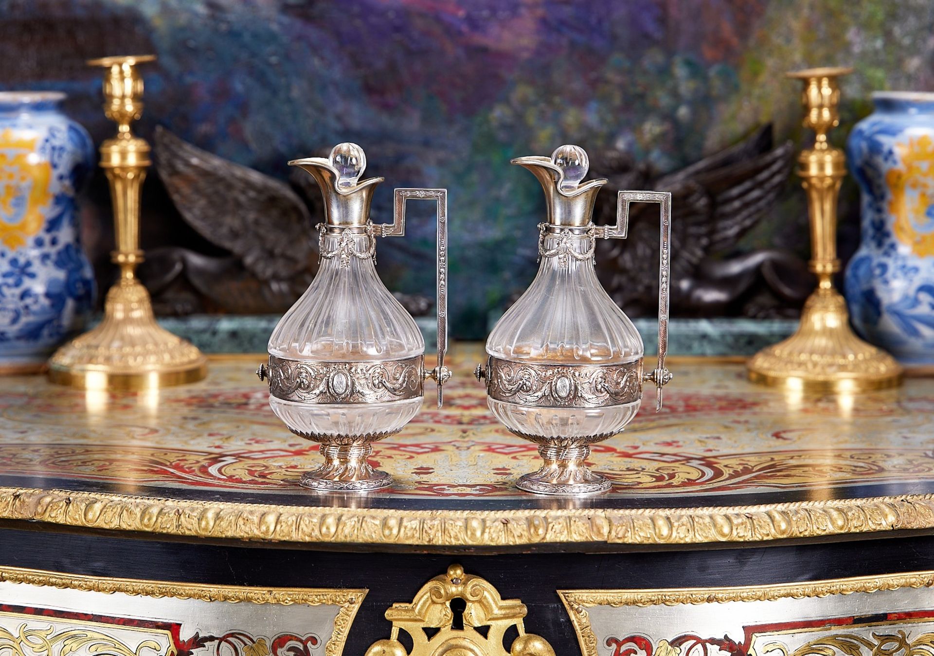 A PAIR OF 19TH CENTURY FRENCH SILVER AND GLASS LIQUOR JUGS