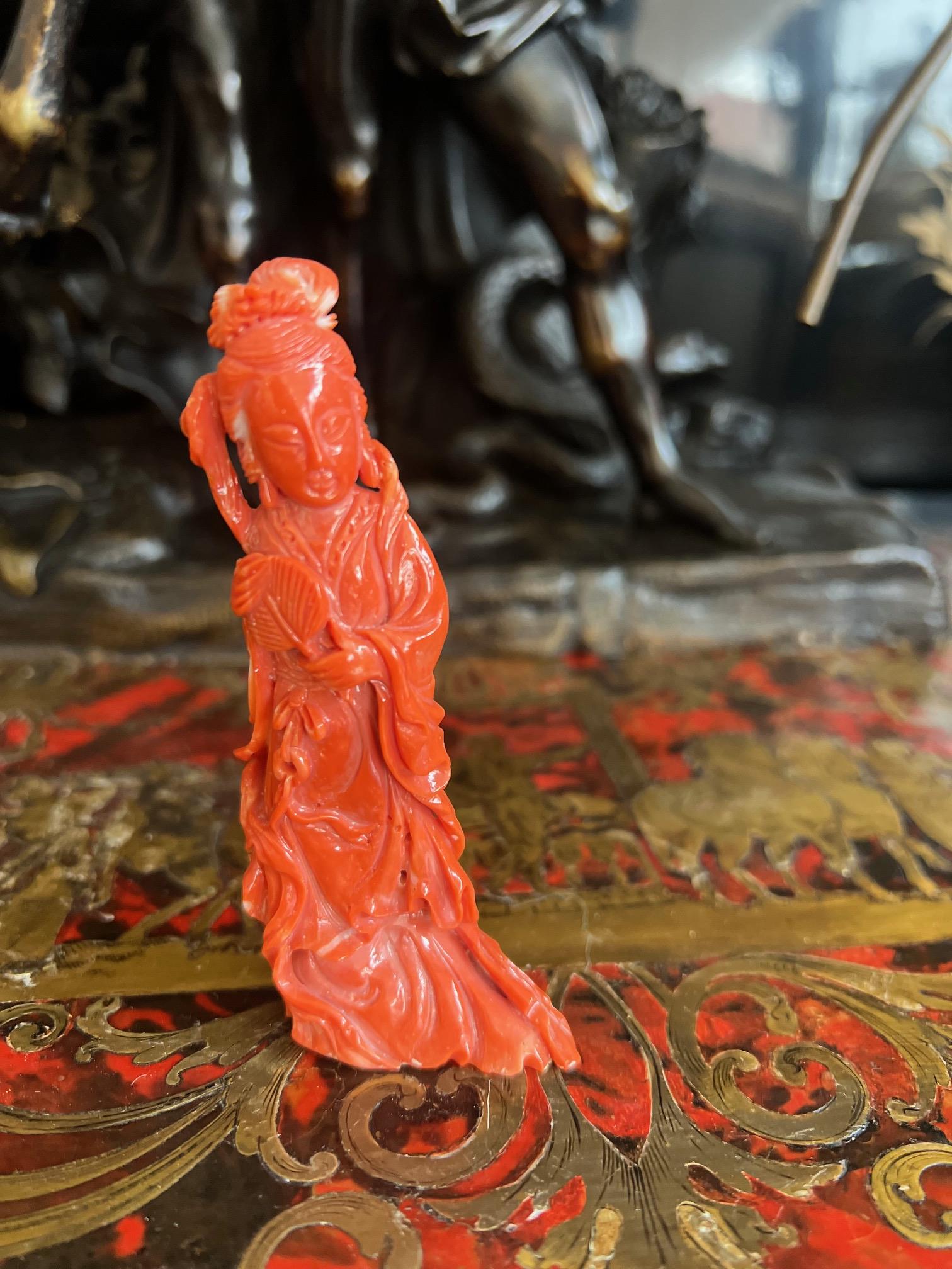 AN EARLY 20TH CENTURY CHINESE CORAL FIGURE