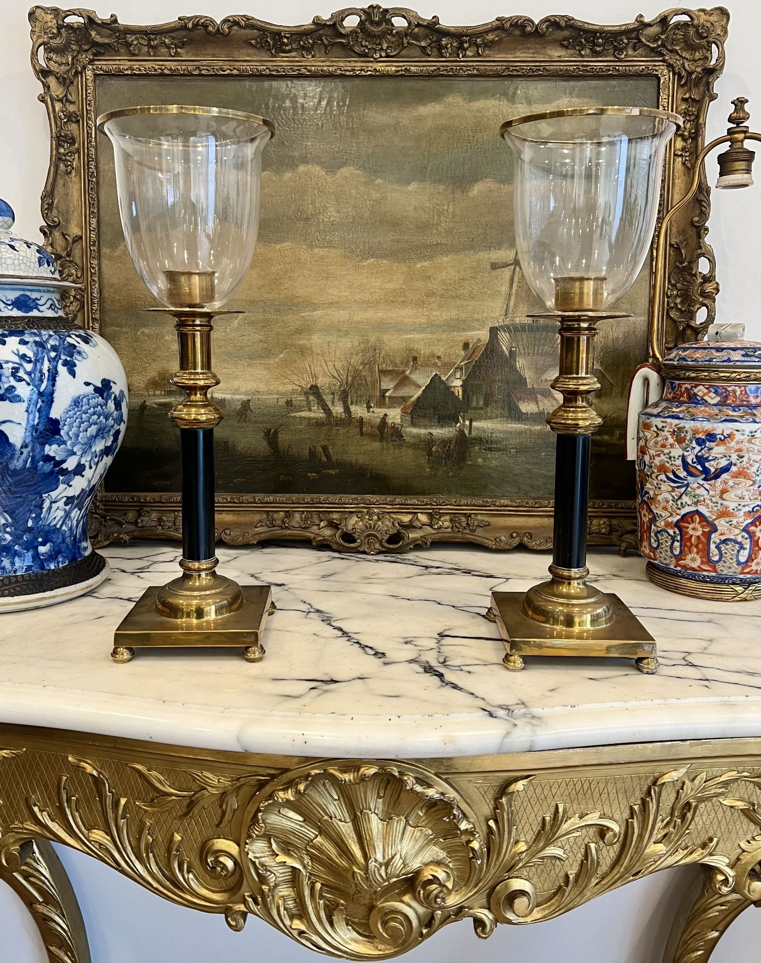 A PAIR OF REGENCY STYLE BRASS HURRICANE LAMPS