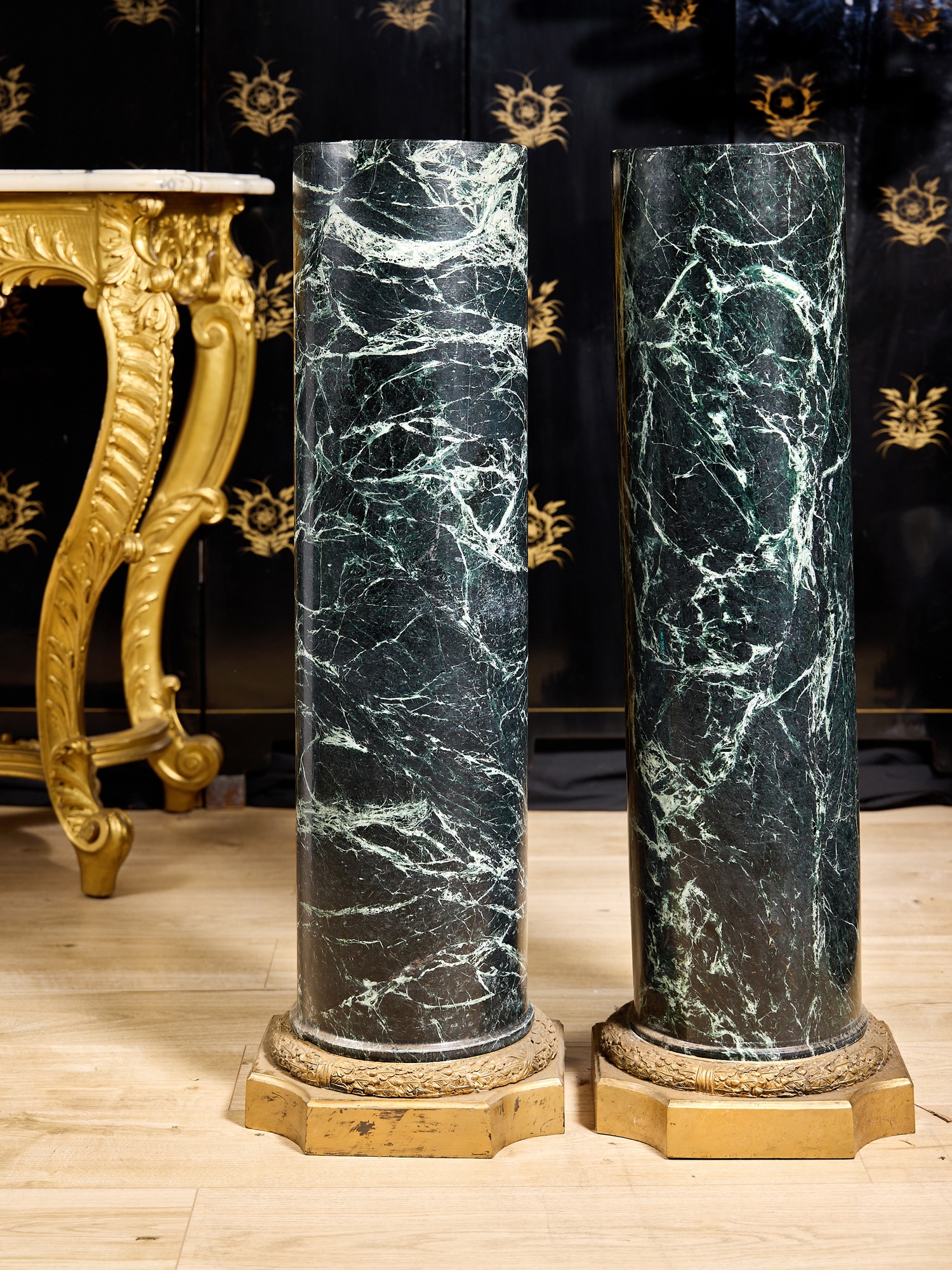 A FINE PAIR OF 19TH CENTURY ITALIAN VERDE ANTICO SOLID MARBLE AND ORMOLU MOUNTED COLUMNS