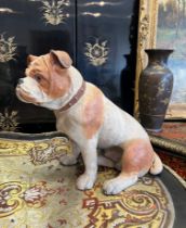 AN EARLY 20TH CENTURY PAINTED TERRACOTTA MODEL OF A BULLDOG