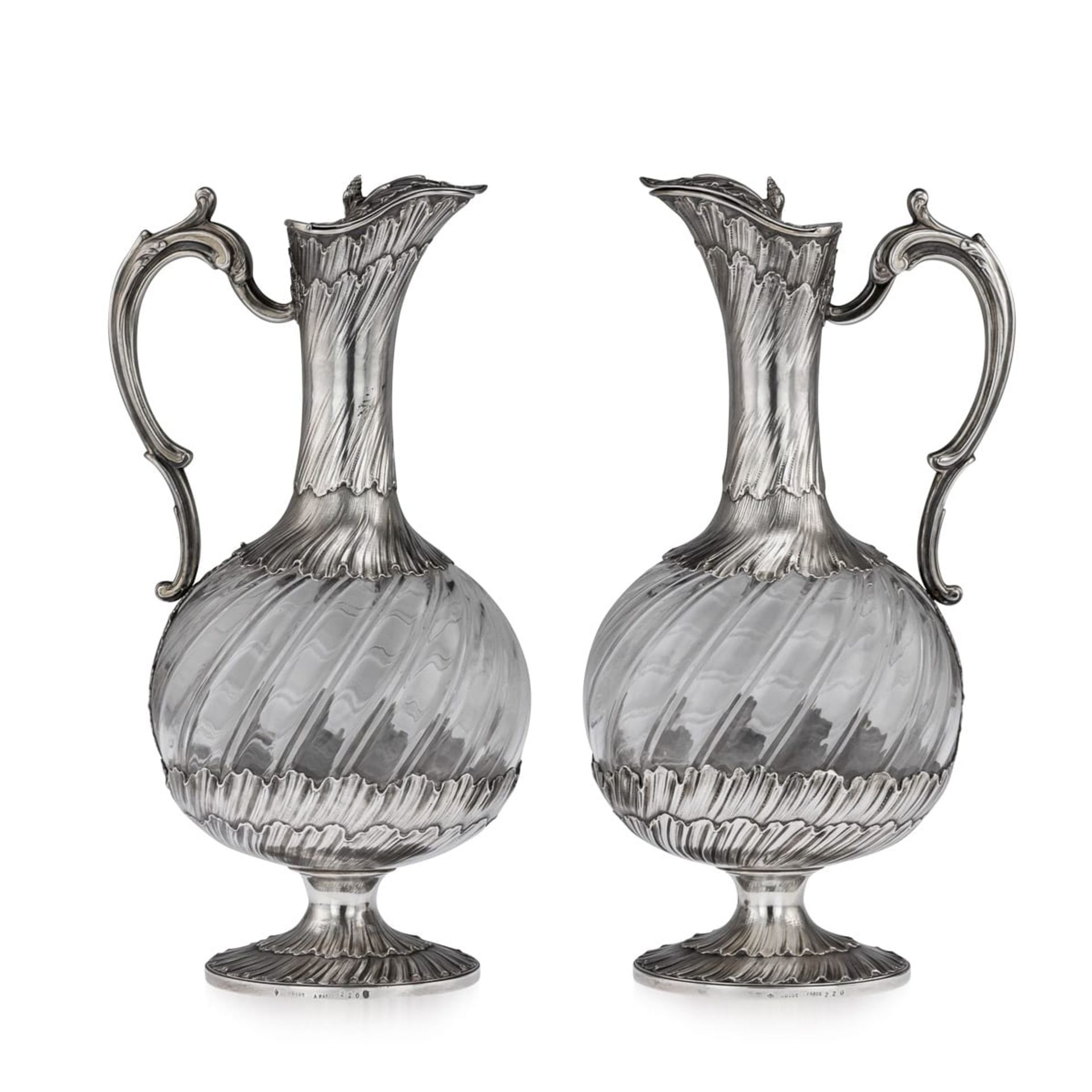 MAISON ODIOT: A PAIR OF 19TH CENTURY SILVER AND GLASS CLARET JUGS CIRCA 1890