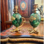 A PAIR OF SILVER GILT AND MALACHITE EGG SHAPED CANDLESTICKS